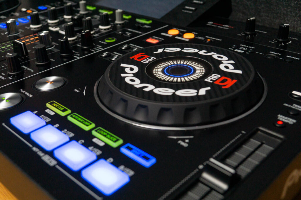 Artistic photo taken at an angle across one of the decks of a freshly serviced Pioneer XDJ.
